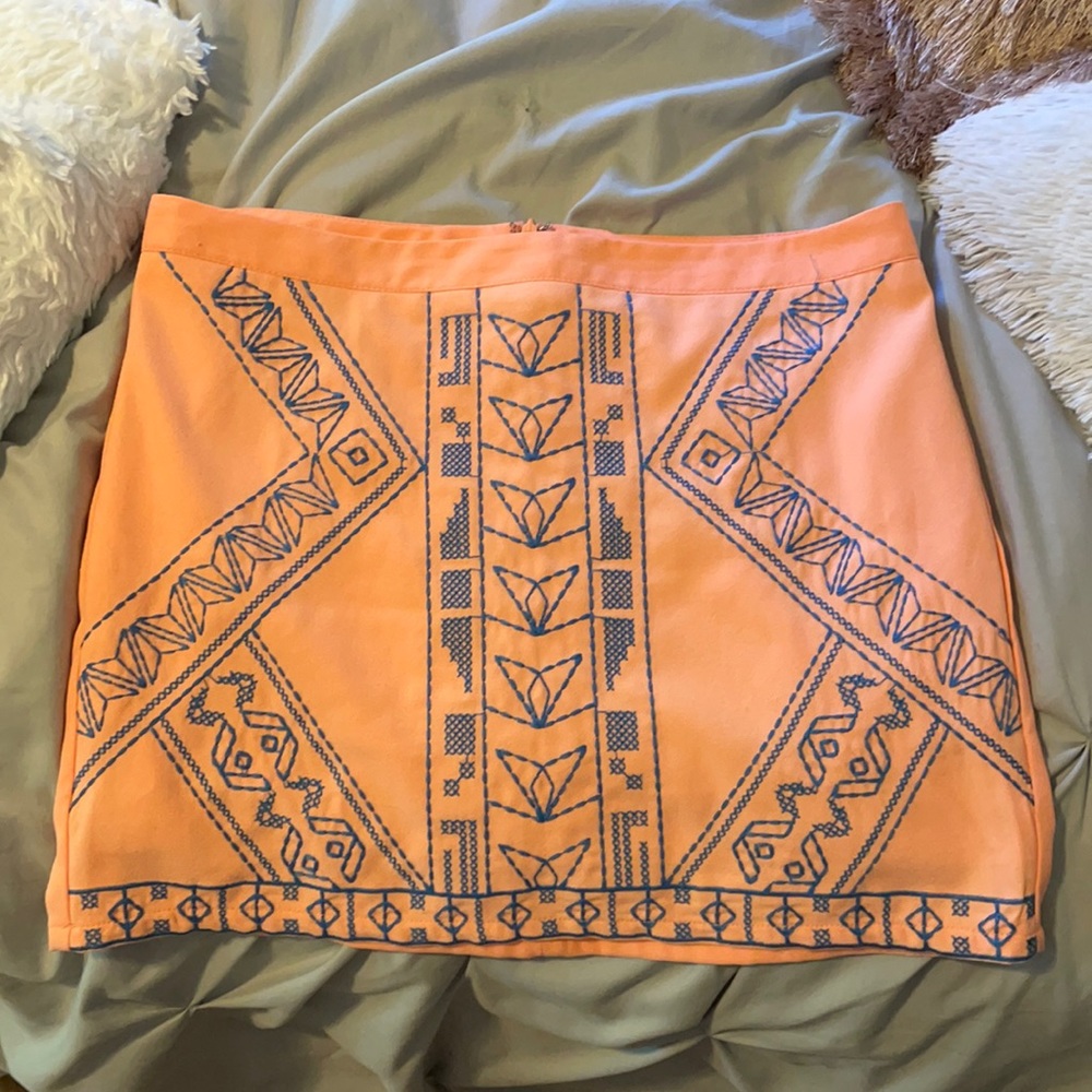 Pink skirt with blue embroidery